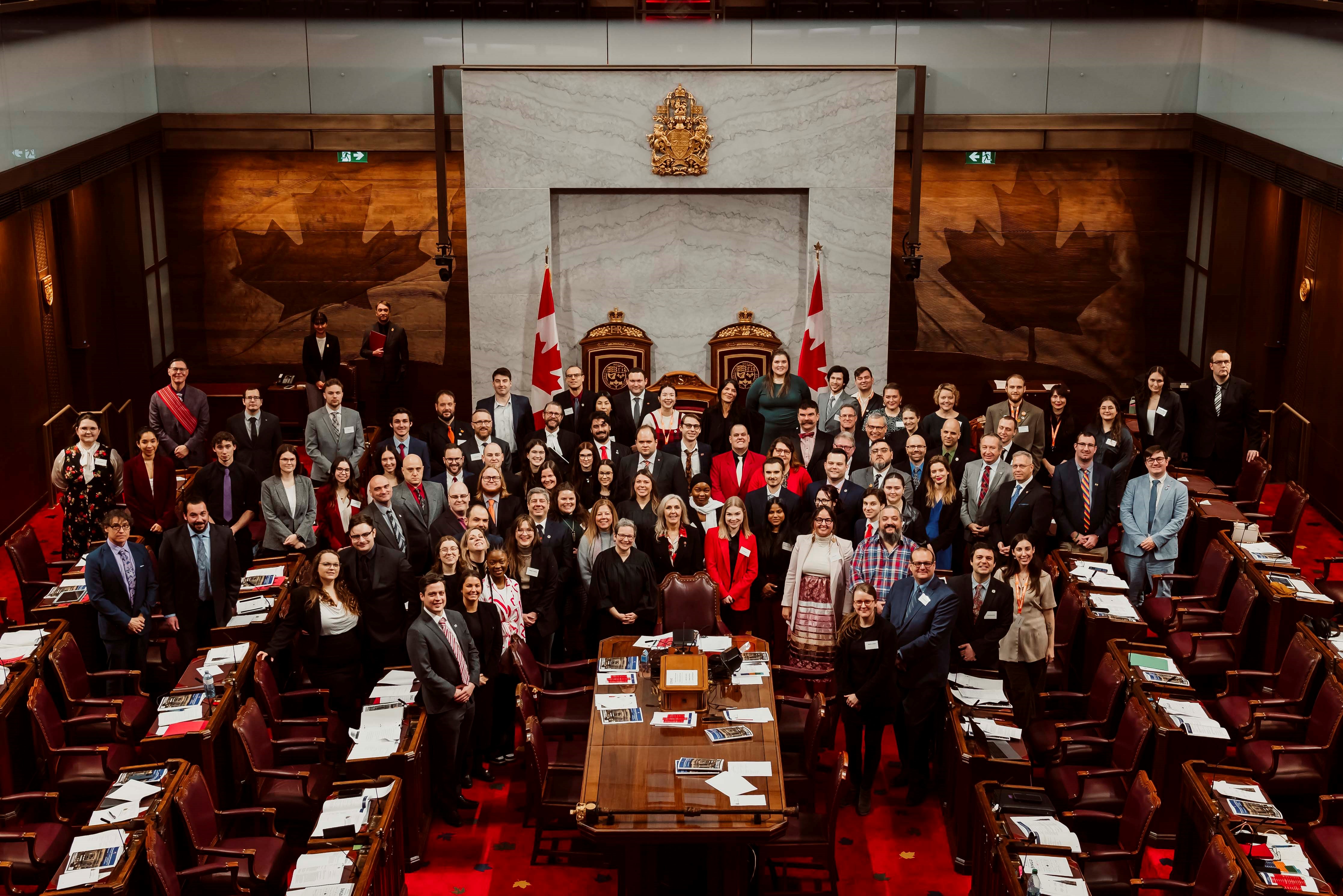 Saturday, January 27, 2024 – Senator Rebecca Patterson, centre; participating in the role of governor general in Laurentian University’s Model Parliament alongside students and alumni, coordinated by SENgage; Senate Chamber, Senate of Canada Building, Ottawa, Ontario. Photo credit: Laurentian University