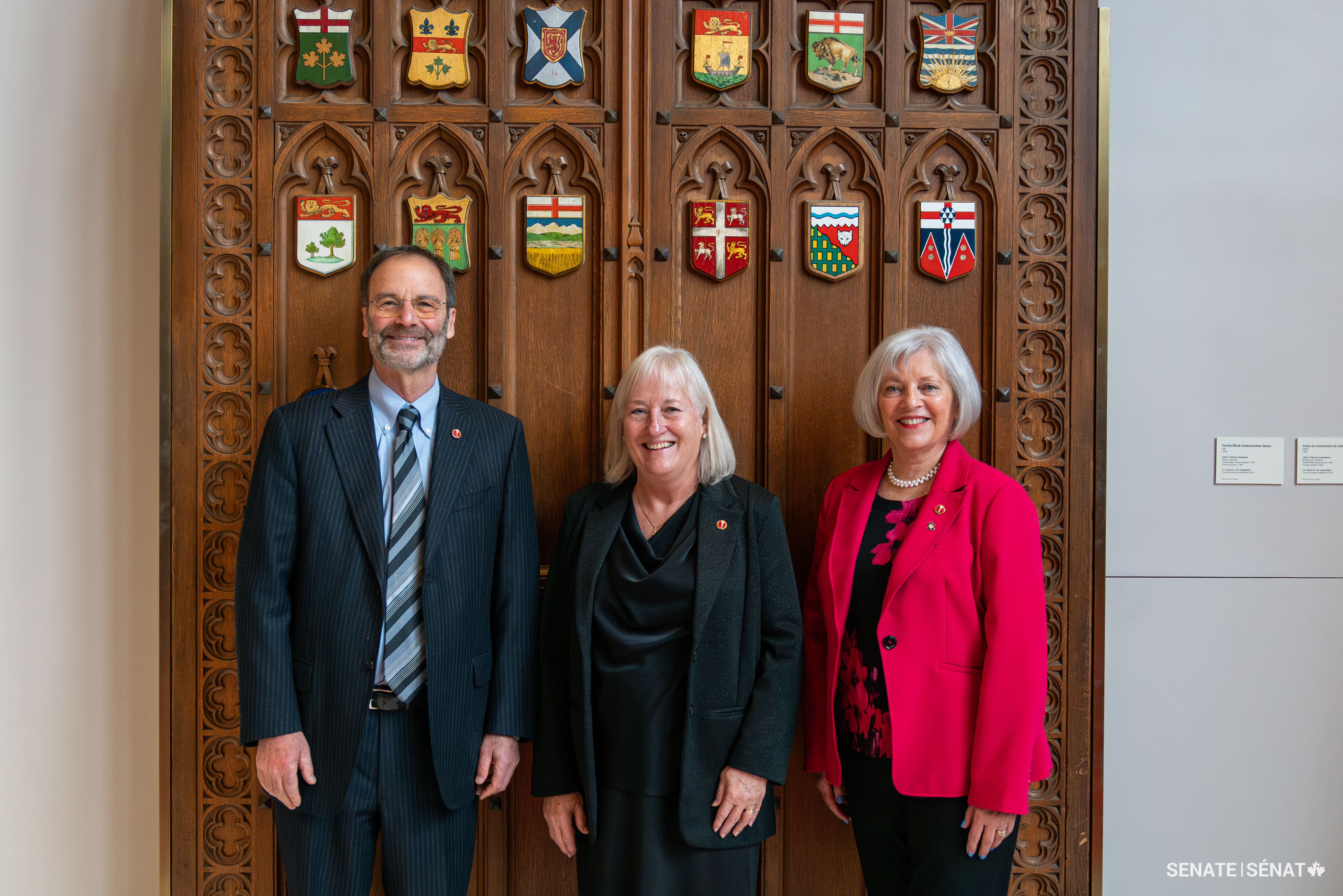 From left, Senator Marc Gold stands with senators Joan Kingston and Nancy J. Hartling ahead of Senator Kingston’s swearing-in ceremony on November 21, 2023.