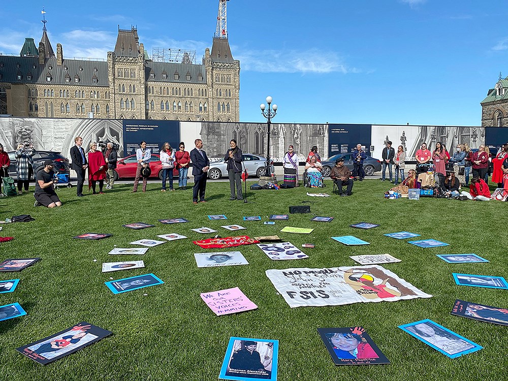 Tuesday, October 4, 2022 – Senators Brian Francis and Michèle Audette, centre, attend the Sisters in Spirit Vigil on Parliament Hill. The national event is held annually on October 4 to honour the lives of missing and murdered Indigenous women, girls, and two-spirit, transgender and gender-diverse people. The senators joined individuals and families grieving the loss of a loved one and echoed their calls for urgent action to end the ongoing genocide.