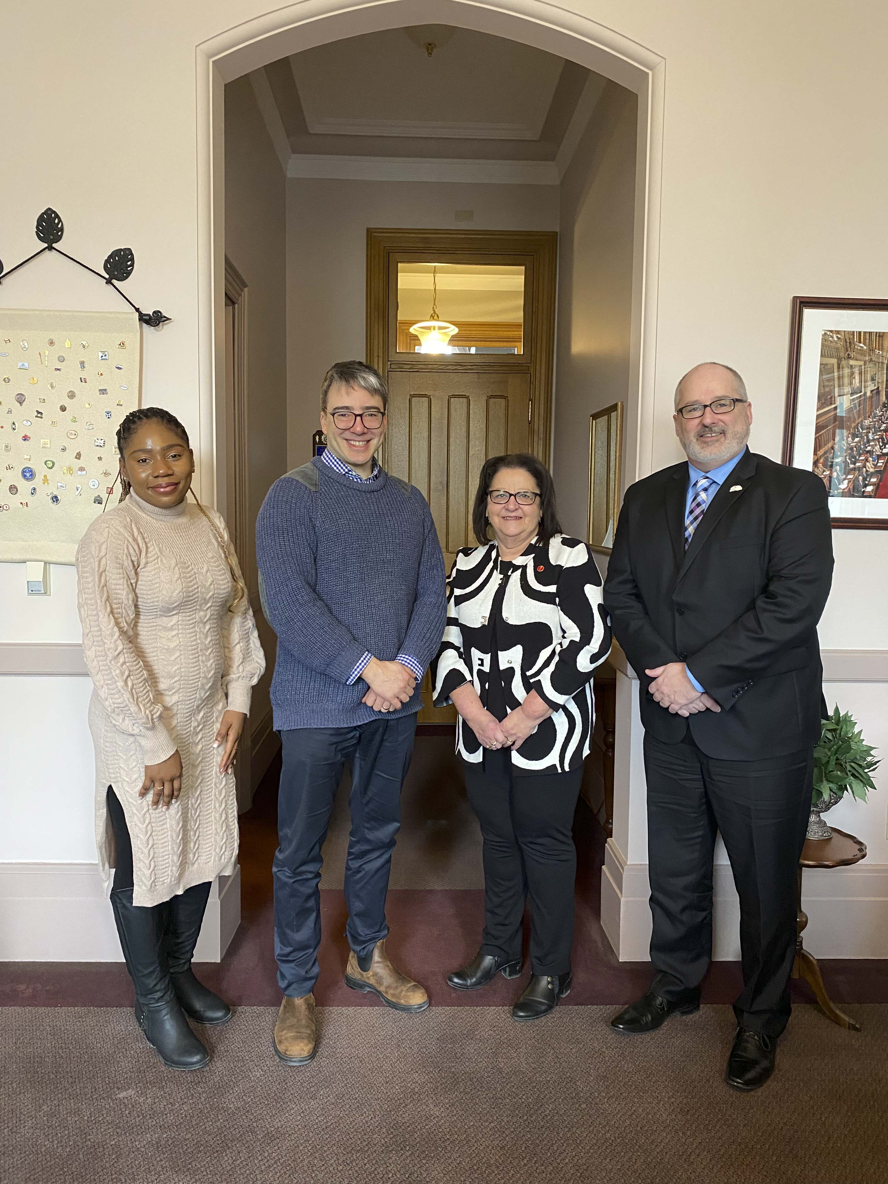Wednesday, February 7, 2024 – Senator Rose-May Poirier, second from right with Fédération nationale des conseils scolaires francophones (FNCSF) Communications Advisor Thérèse Osakanu, FNCSF board member Jean-Sébastien Blais, and FNCSF President Simon Cloutier; meeting about minority French language education; Parliament Hill, Ottawa, Ontario.
