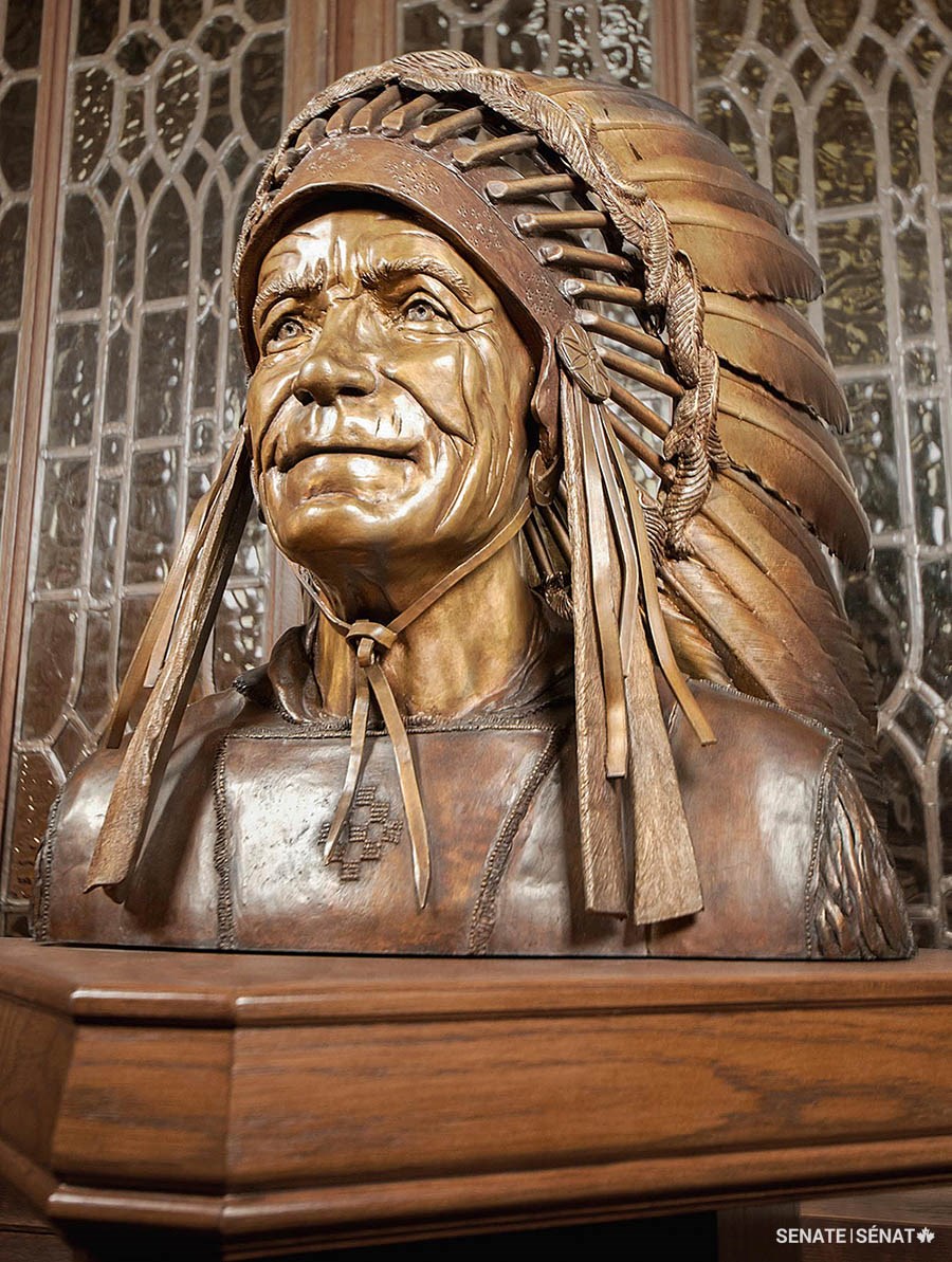 Gatineau sculptor Rosemary Breault-Landry depicted Senator James Gladstone in full Blackfoot ceremonial regalia, including headdress and buckskin shirt. (Bronze, 2001. H: 57cm x W: 50cm x D: 34cm. Senate Artwork and Heritage Collection.)