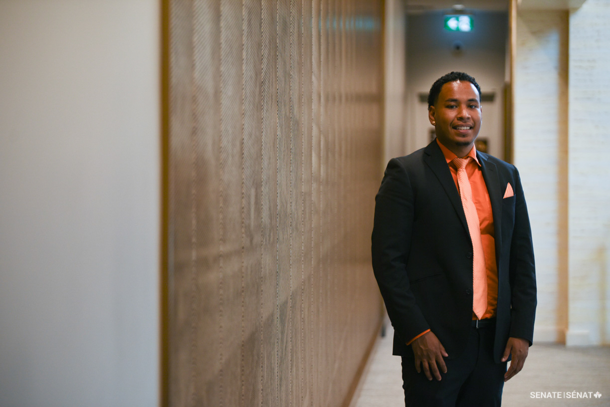 Voices of Youth Indigenous Leaders 2022 participant Jama Maxie poses in the Senate of Canada Building.