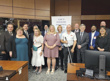 Group photo of members of the deafblind community with senators Percy Mockler, Tony Loffreda, Brent Cotter, Elizabeth Marshall, Sabi Marwah, Yonah Martin, and former senator Vim Kochhar, in a committee room.