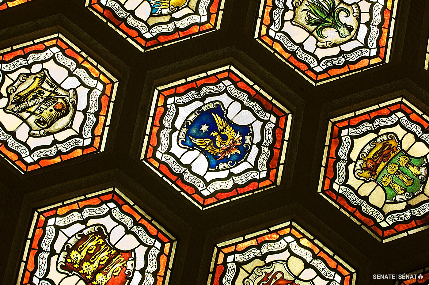 A phoenix, rising from its ashes, appears among the 105 stained-glass panels in the Senate foyer ceiling. It alludes to the 1916 Parliament Hill fire and the resurrection of Centre Block.