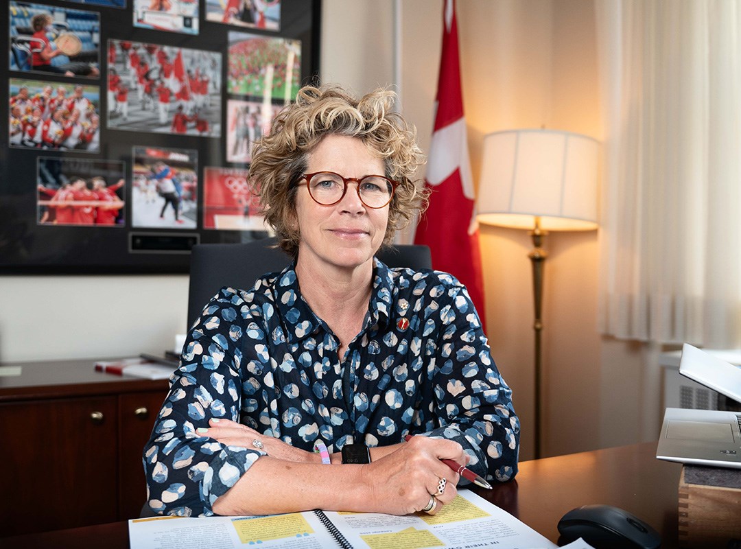 Senator Marnie McBean sitting at a desk in her office.