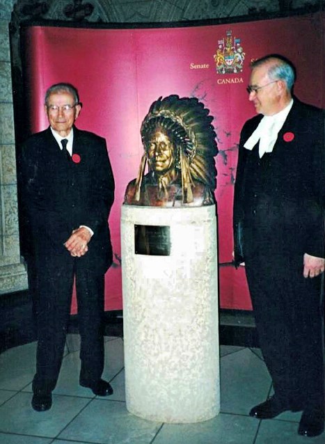The bust was unveiled in a 2001 ceremony where Mr. Gladstone’s son Fred, left, and Senate Speaker Daniel Hays, right, paid tribute to the trailblazing senator. (Photo credit: The family of the Honourable James Gladstone)