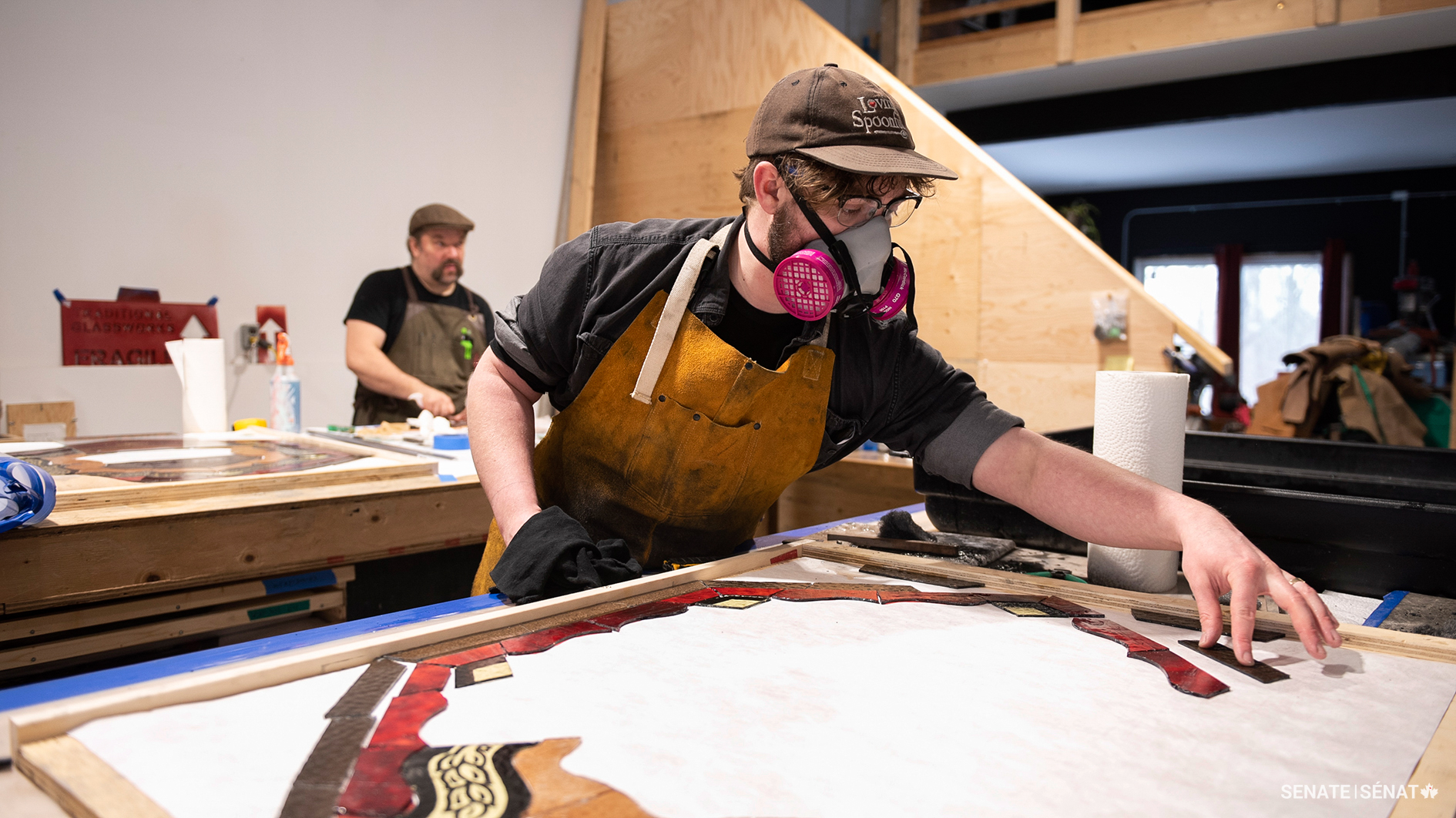 Each decorative panel is like an intricate jigsaw puzzle. Conservator Liam Fenton lays out the dozens of individual panes that make up a window exactly as they were originally.
