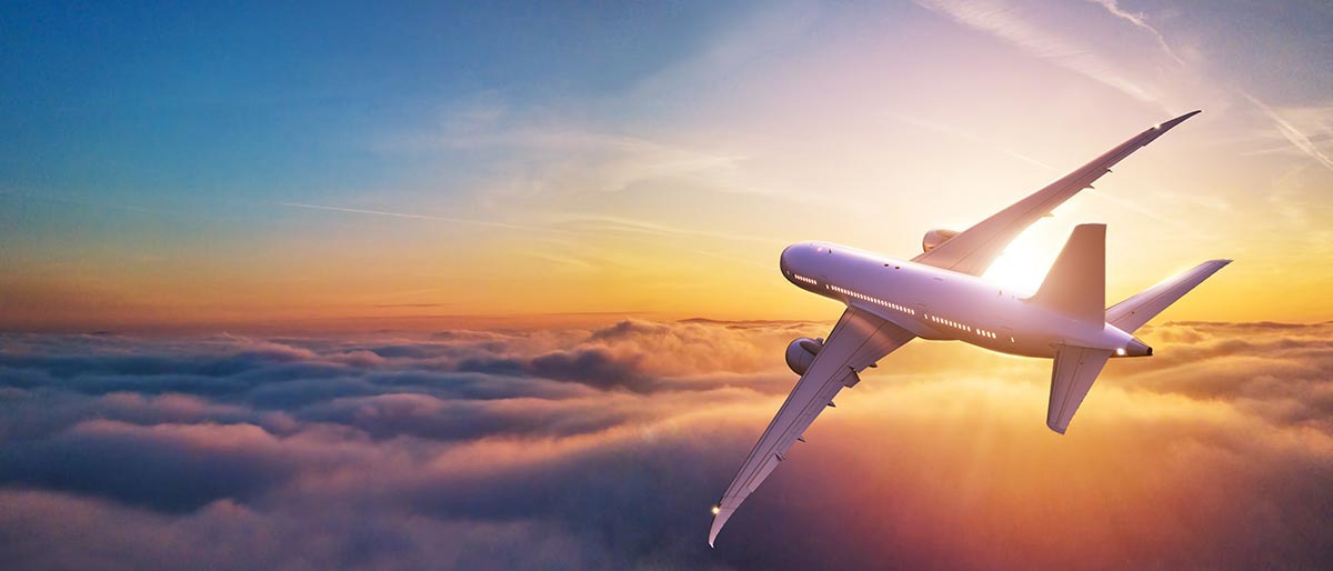 An airplane flying above the clouds in the sky