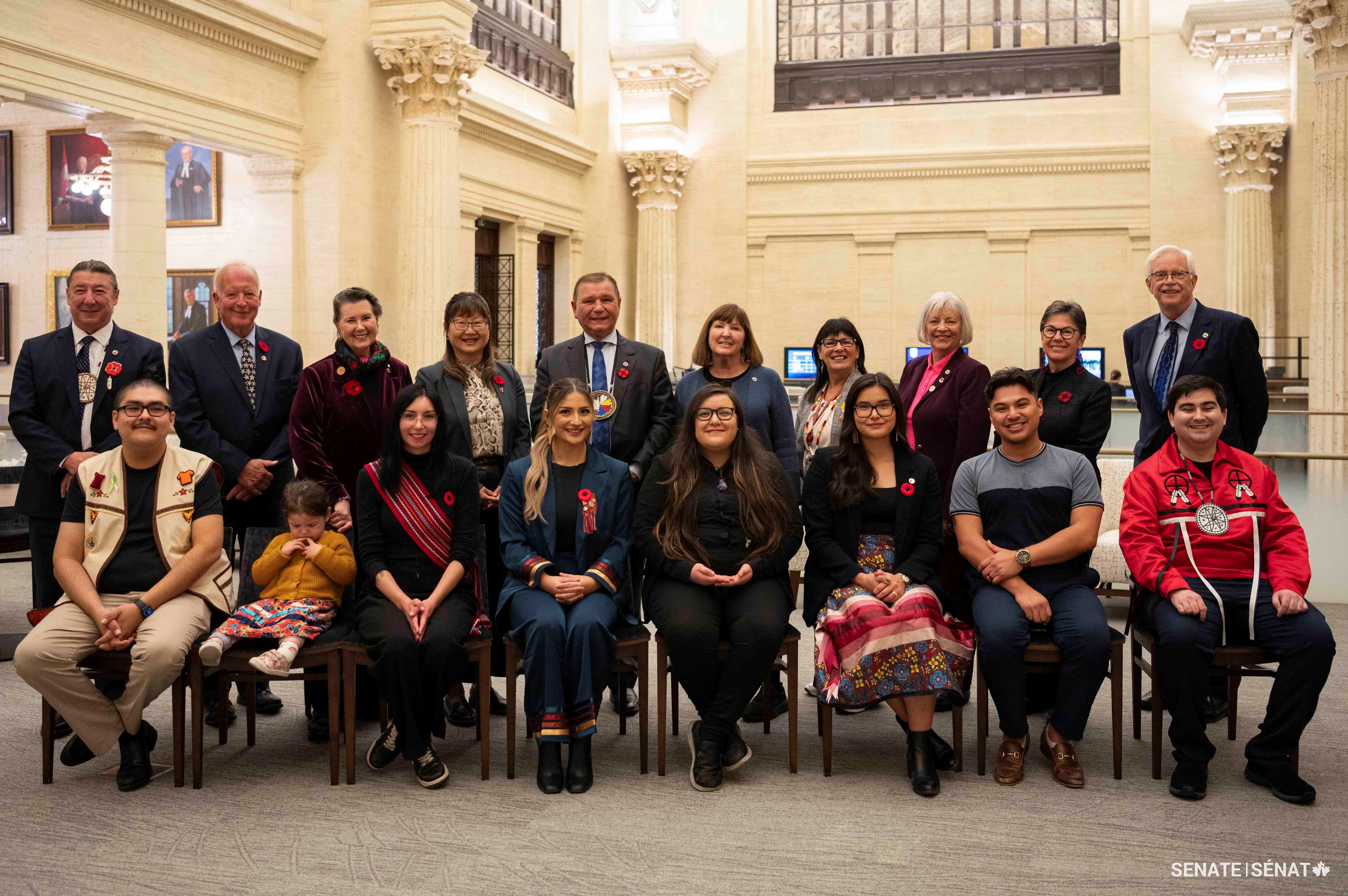 Wednesday, October 30, 2024 – From left to right in the back row: Senators Paul Prosper, John McNair, Marilou McPhedran, Yonah Martin, Brian Francis, Mary Coyle, Judy White, Nancy J. Hartling, Kim Pate, and David M. Arnot with a group of young Indigenous leaders during the Voices of Youth Indigenous Leaders event; Senate of Canada Building, Ottawa, Ontario.