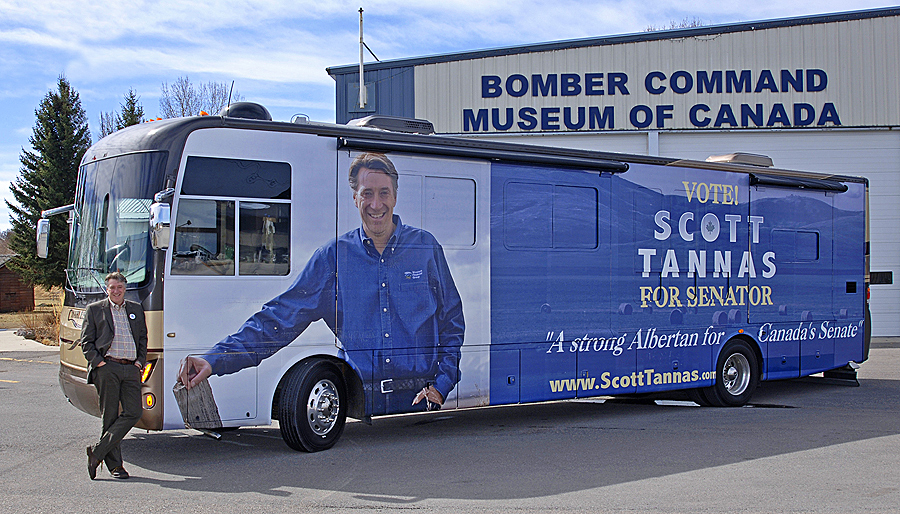 Senator Scott Tannas stands beside his campaign bus during a stop in Nanton, Alberta in 2012. The senator tackled his Senate election campaign one small Albertan town at a time, visiting more than 50 rural communities.
