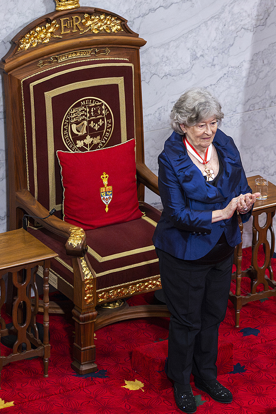 Governor General Louise Arbour stands before <a href='https://sencanada.ca/en/sencaplus/how-why/the-senate-thrones-modern-day-masterpieces-in-a-historic-setting/' target='_blank'>the Throne of Canada</a> in the Senate Chamber shortly after being sworn in as Canada’s 31st governor general on Monday, June 8, 2026. (Photo credit: Department of Canadian Heritage)