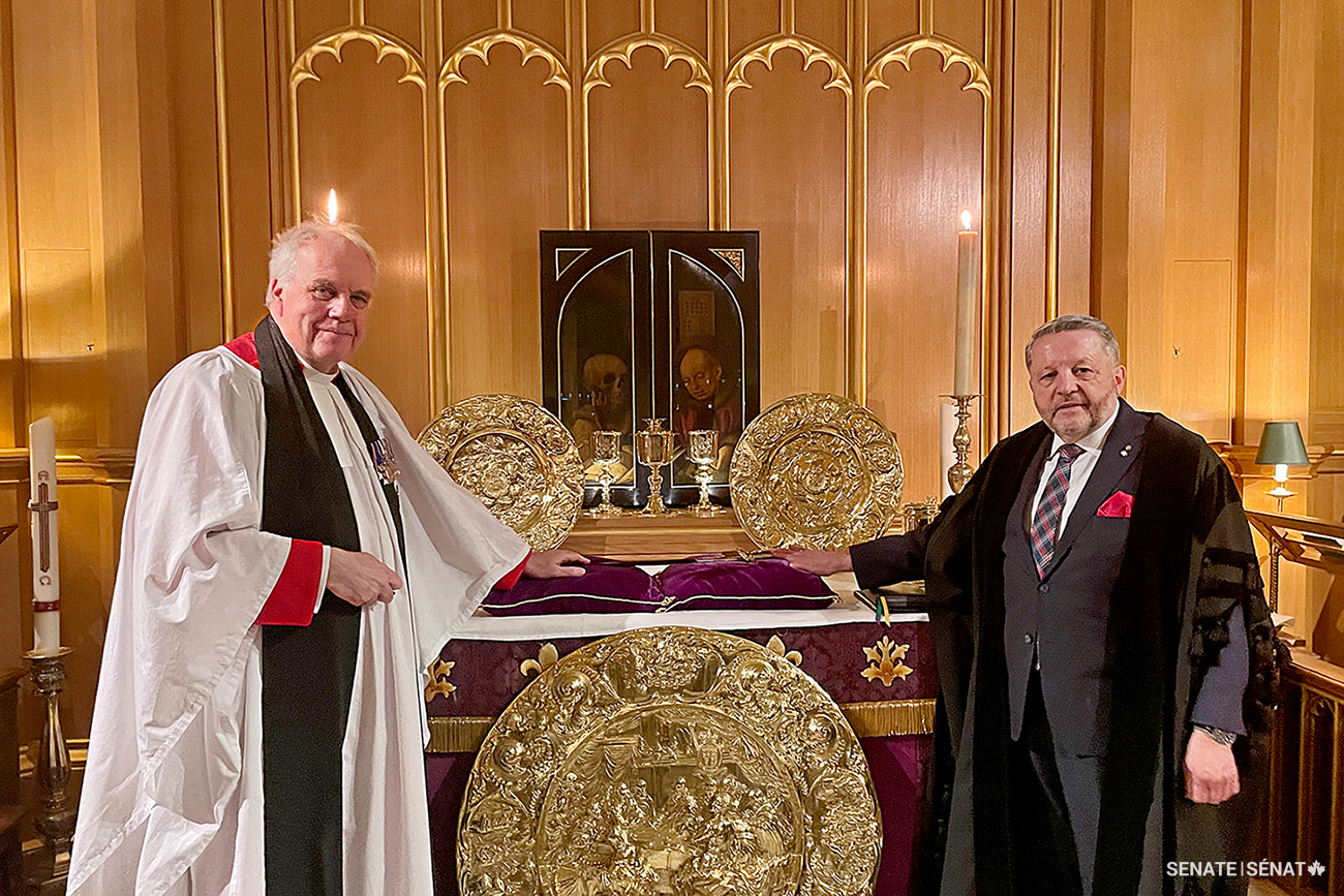 From left, Cannon Paul Wright, Sub-Dean of the Chapel Royal, and Usher of the Black Rod J. Greg Peters stand beside the altar of the Chapel Royal in St. James’s Palace, London, United Kingdom, on March 11, 2025, during the blessing ceremony for the new sword.
