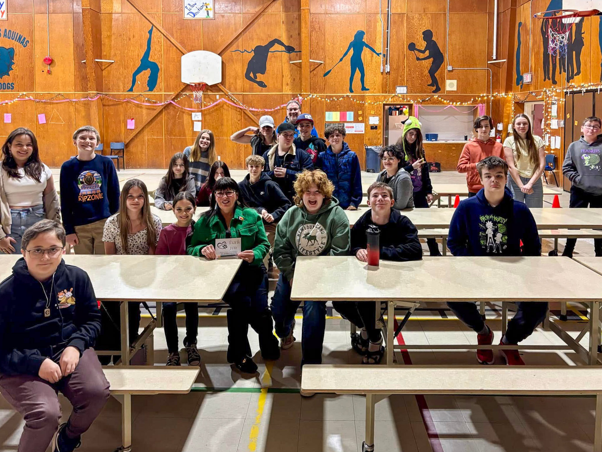 Tuesday, March 4, 2025 – Senator Judy White, centre, with students from St. Thomas Aquinas; school visit; Port au Port East, Newfoundland and Labrador, photo credit: Mr. Corey Ivany, Principal, St. Thomas Aquinas.