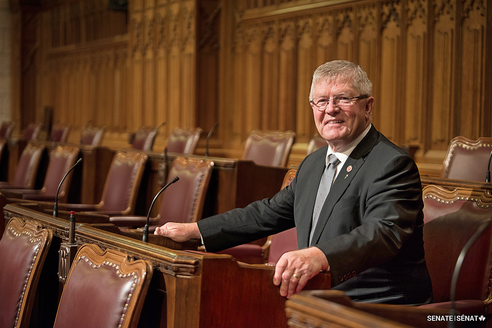 Senator Don Plett sits at his desk in the original Senate Chamber in 2018, not long before Centre Block closed for rehabilitation. The Senate has since temporarily moved to the <a href='https://sencanada.ca/en/about/scb/' target='_blank'>Senate of Canada Building</a> in Ottawa’s former downtown train station.