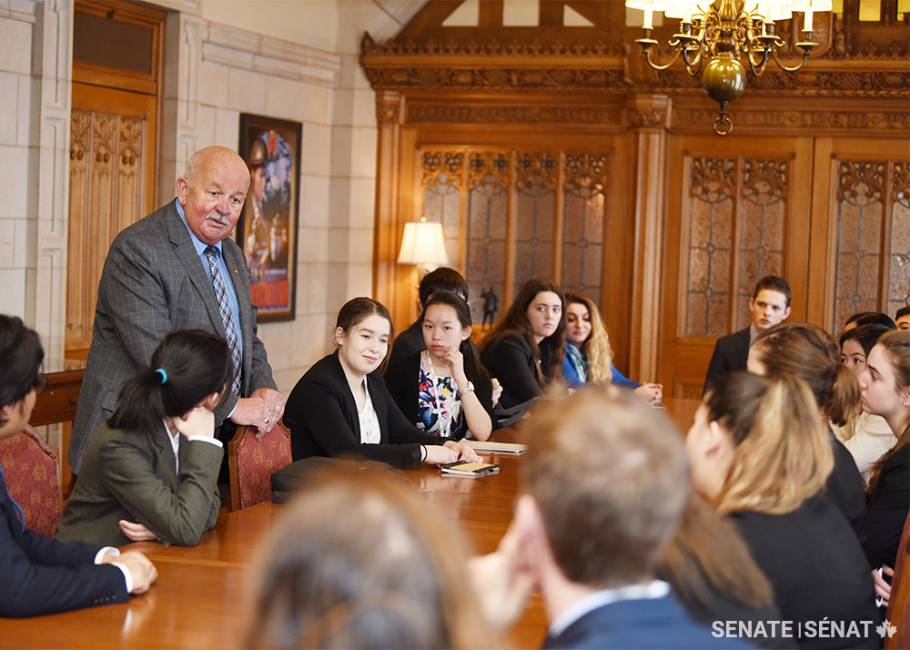 Senator Mercer meets with participants of the Forum for Young Canadians in March 2018.