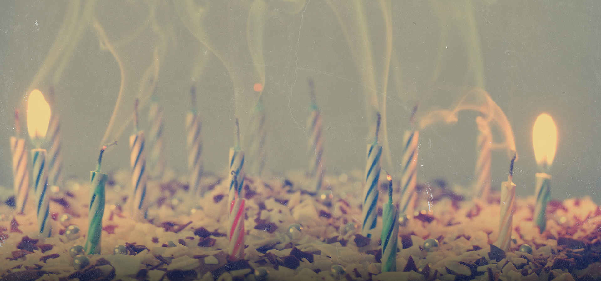 A cake with blown-out candles.
