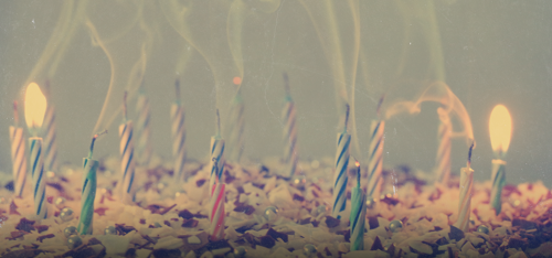 A cake with blown-out candles.