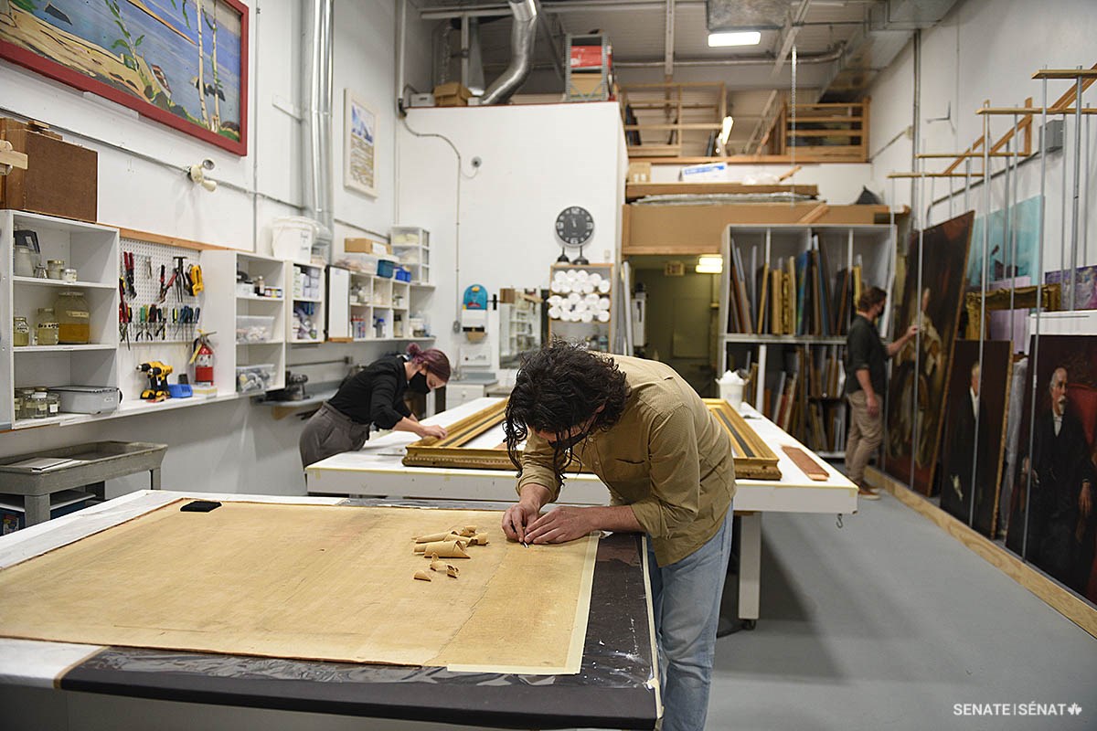 Conservators work simultaneously on several different pieces in Legris Conservation’s studio.