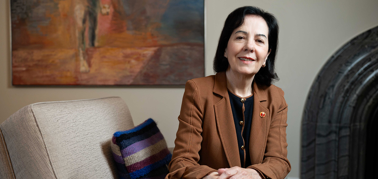 A woman sits in her office.