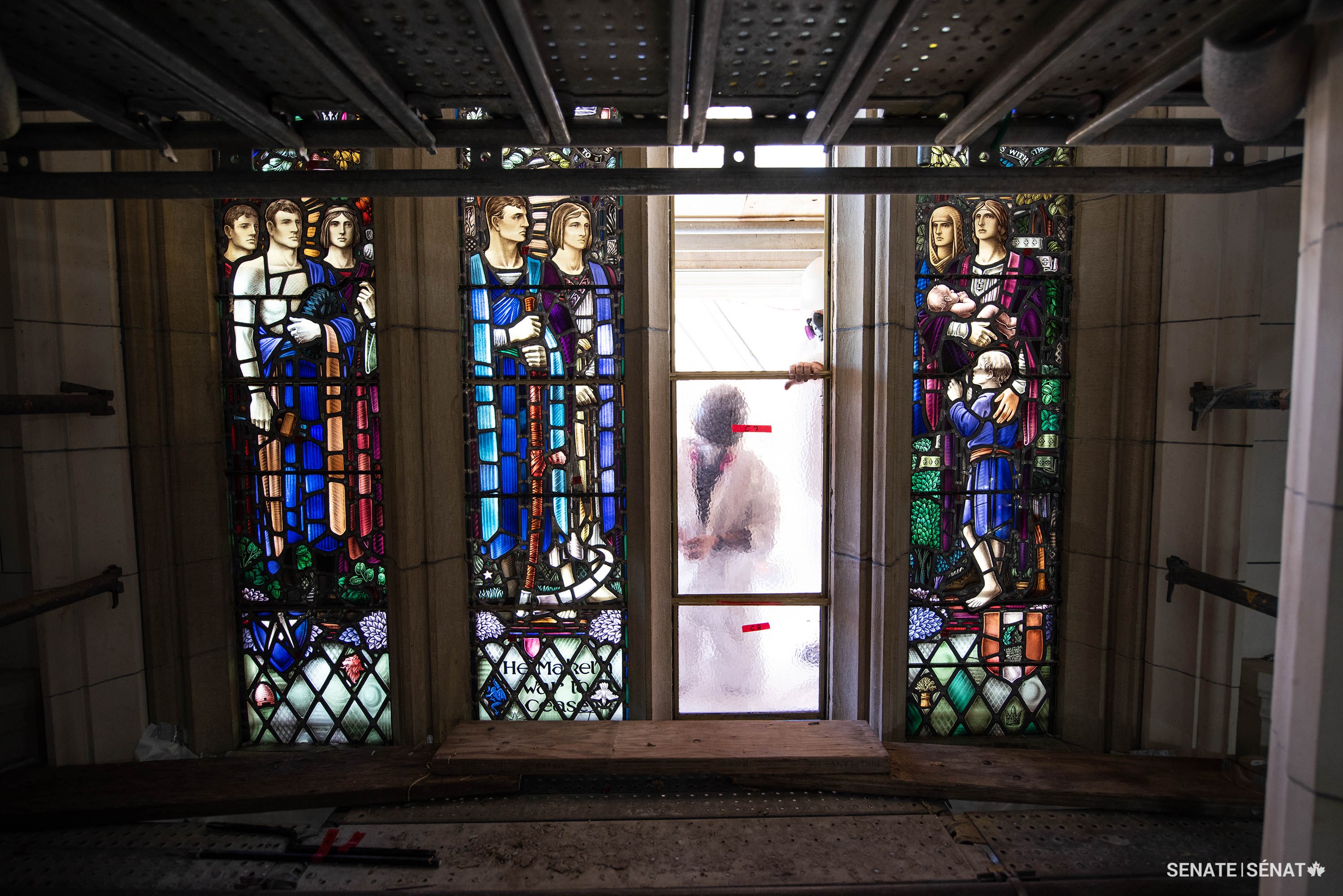 The exquisitely detailed panels from The Dawn of Peace are replaced with plain glass so artist Frank S.J. Hollister’s creations can be refurbished by Mr. Thompson and his team of top conservators.