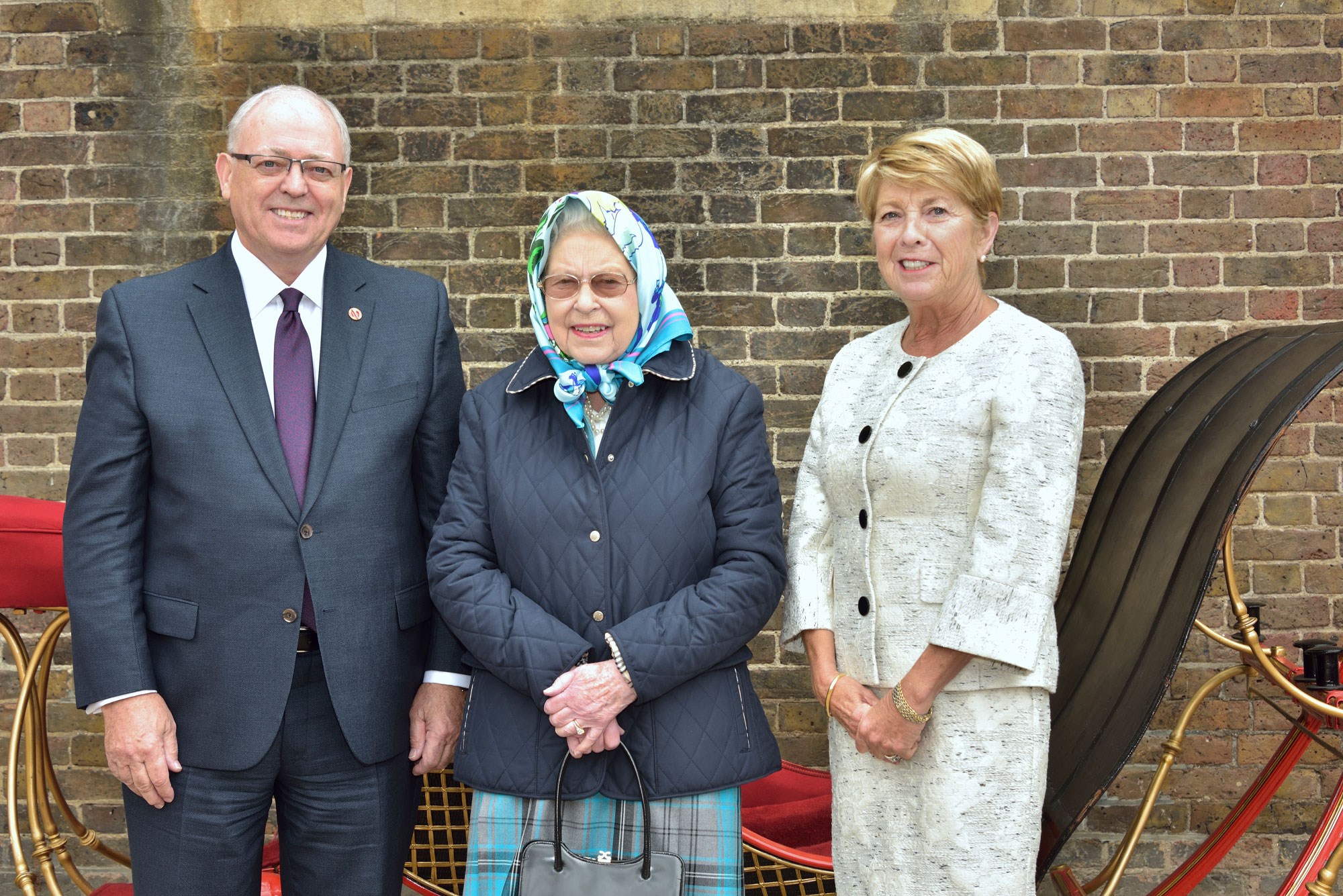 The Queen, centre, stands with Speaker of the Senate George J. Furey and his wife Karen Furey in the Royal Mews, Windsor Castle, in 2018.