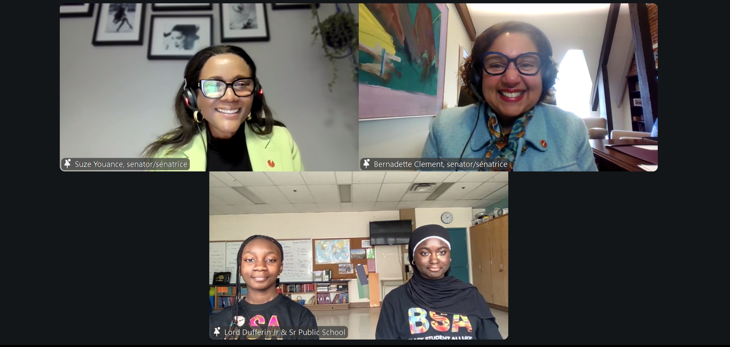 A Zoom call screenshot, featuring a group of women smiling.
