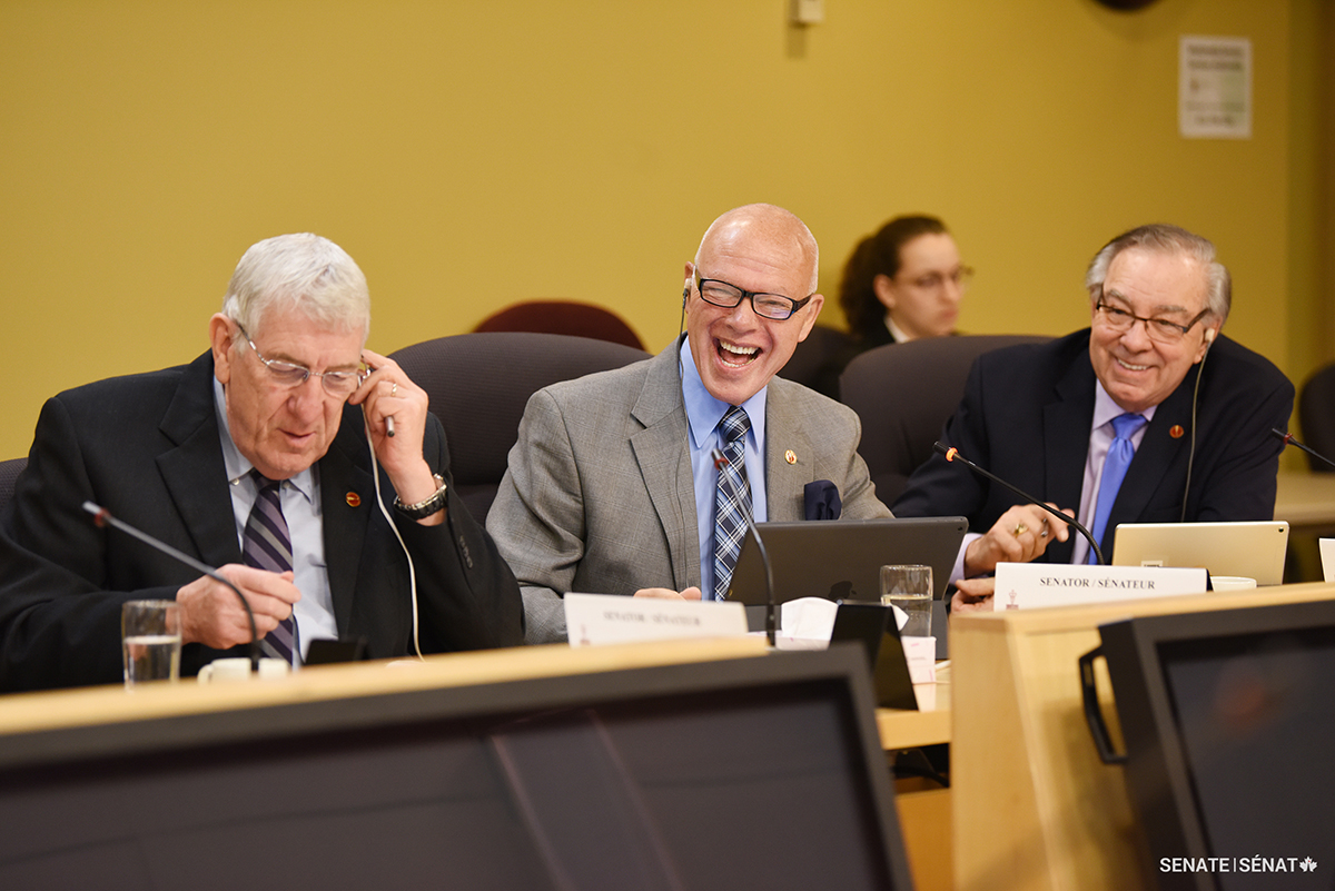 Senator Jean-Guy Dagenais, centre, listens to testimony during a Senate committee meeting with then-senators Norman E. Doyle, left, and Ghislain Maltais.