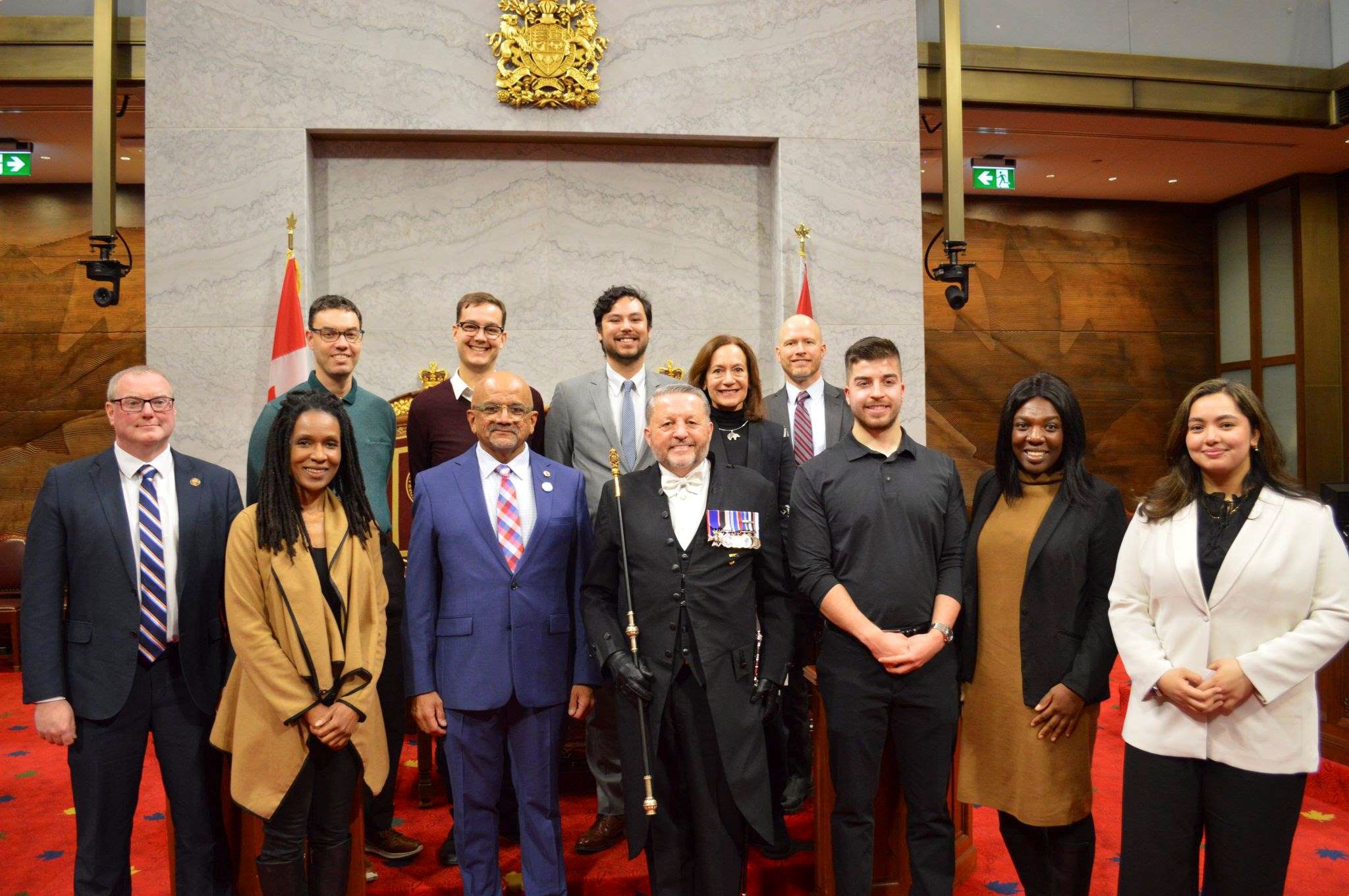 Monday, February 5, 2024 – Senator Andrew Cardozo and Usher of the Black Rod, M. Greg Peters, third and fourth from left; tour of the Senate for members of the Institute of Public Administration of Canada (National Capital Region); Senate Chamber, Senate of Canada Building, Ottawa, Ontario.
