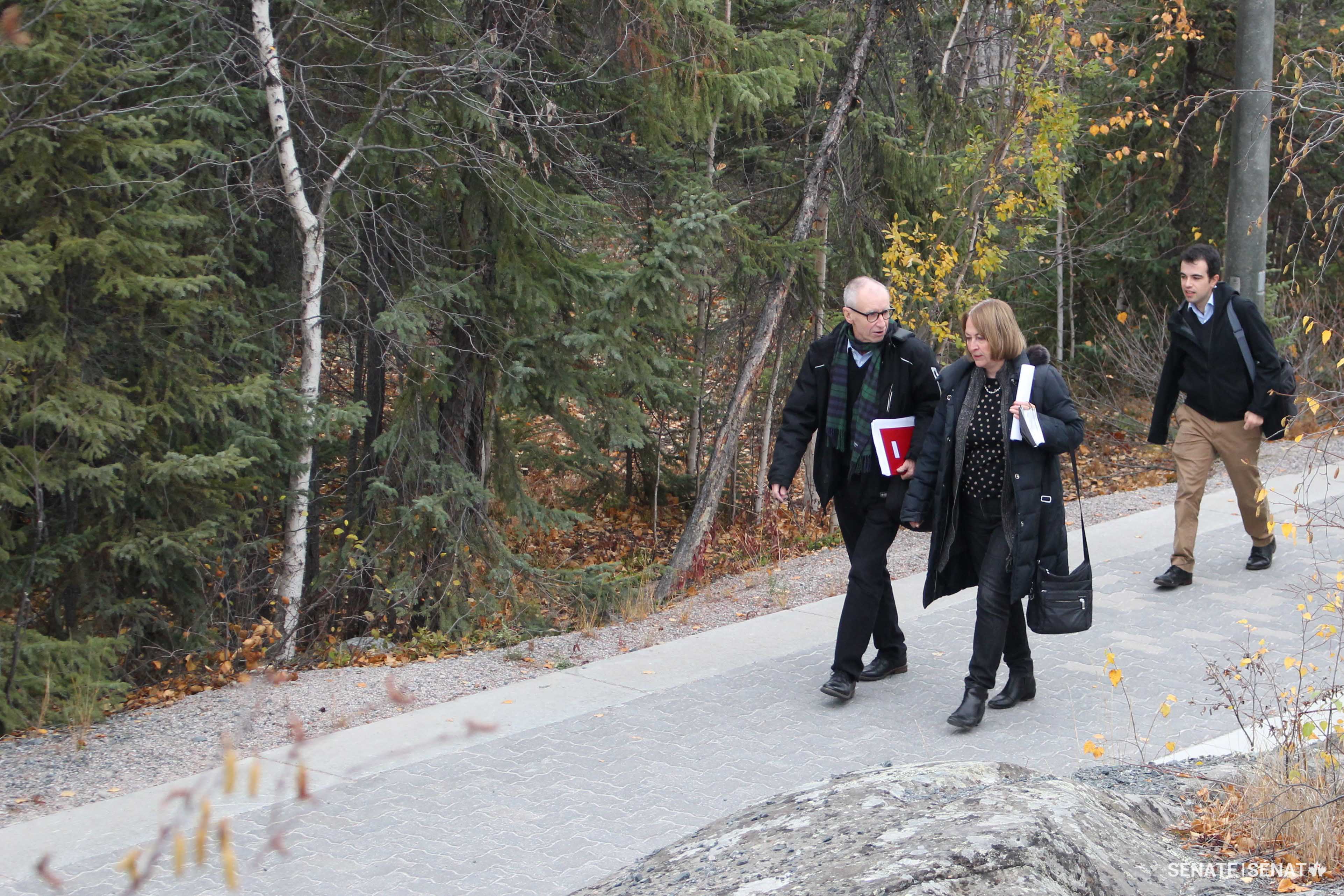 Senators Dean and Dasko confer after leaving Joint Task Forth (North) Headquarters in Yellowknife, Northwest Territories.