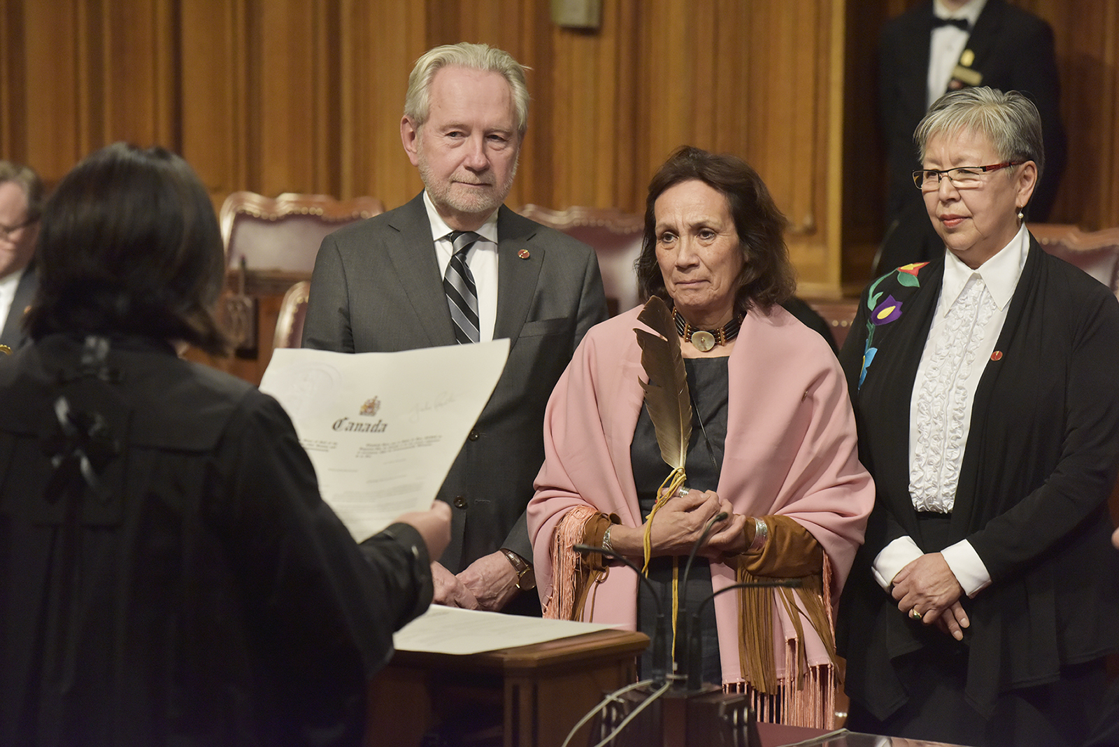 Senator McCallum attends her swearing-in ceremony with Senator Peter Harder and former senator Lillian Eva Dyck.
