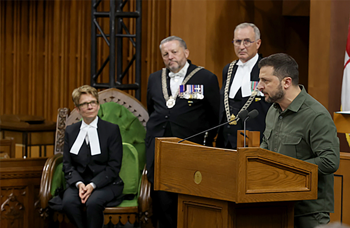 Speaker Gagné listens as Mr. Zelenskyy vows to defeat the Russian invaders. “Ukraine, not genocide, will be victorious,” he said.