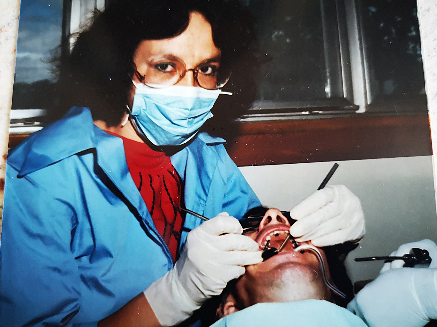 Senator McCallum tends to a patient in this photo from 1978, when she was a dental nurse. This is around the time when she started to view her profession as a public service, and not strictly as a business. (Photo credit: Office of Senator Mary Jane McCallum)