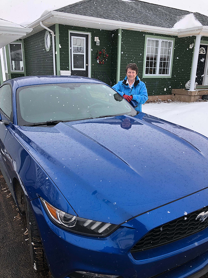 Senator Griffin with her little blue 2017 Mustang