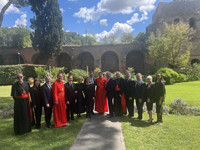 A group of dignitaries in formal and religious attire pose for a photo in Vatican City, Rome, Italy.