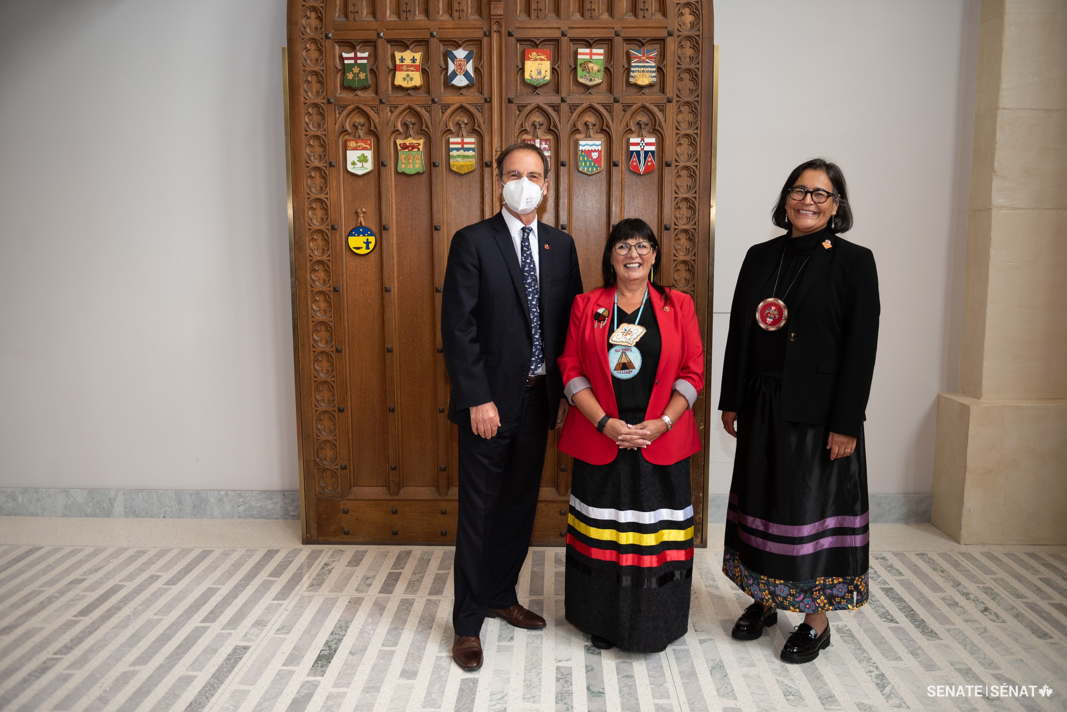 Senator Marc Gold poses with senators Judy A. White, centre, and Michèle Audette outside the Red Chamber on September 19, 2023.