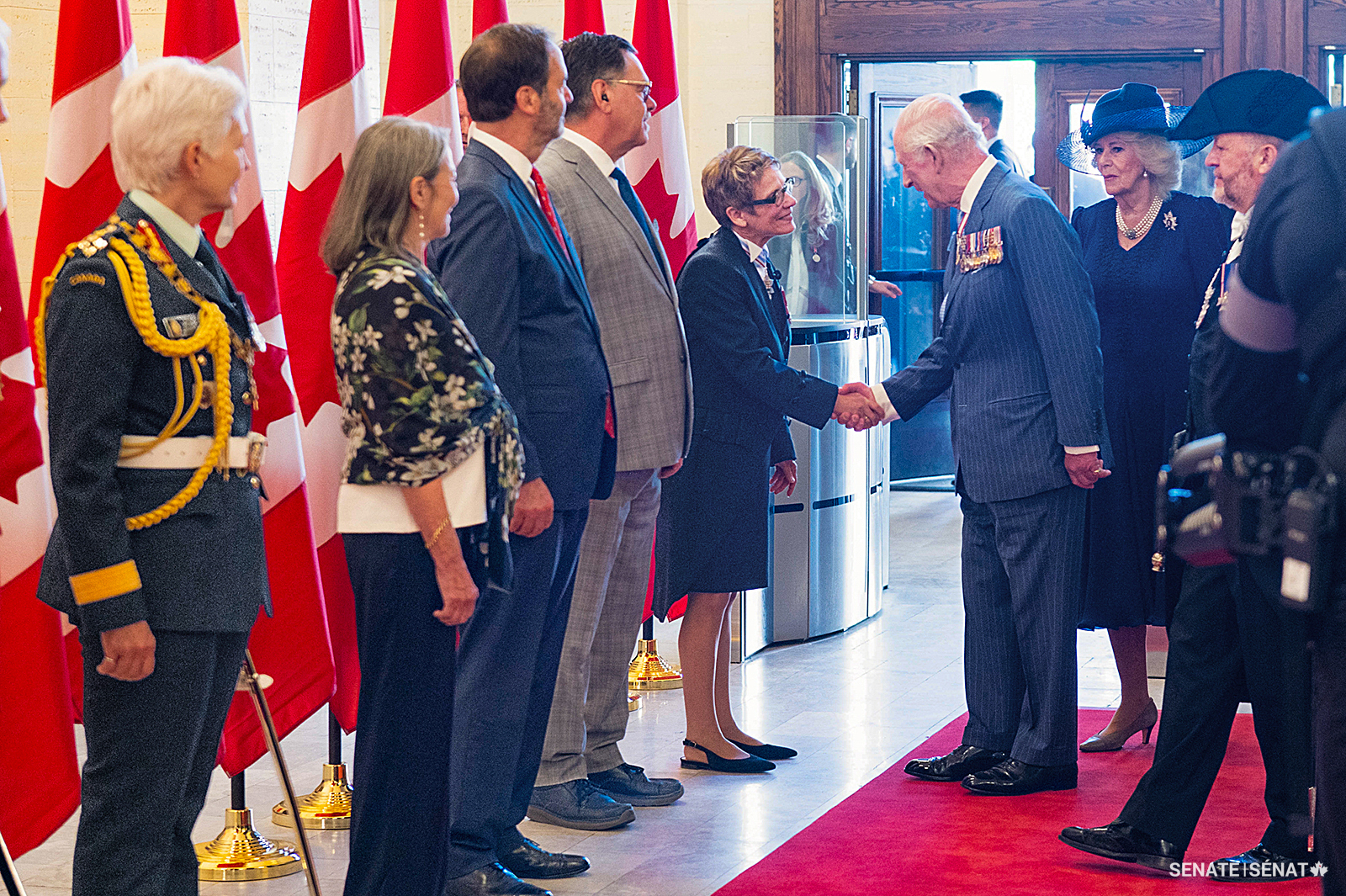 The Speaker of the Senate, the Honourable Raymonde Gagné, C.M., O.M., officially welcomes King Charles III as he enters the Senate of Canada Building to read the Speech from the Throne and open the 45th Parliament on May 27, 2025. It was only the third time that a Canadian monarch had read the throne speech — Queen Elizabeth II opened sessions of Parliament in 1957 and in 1977.
