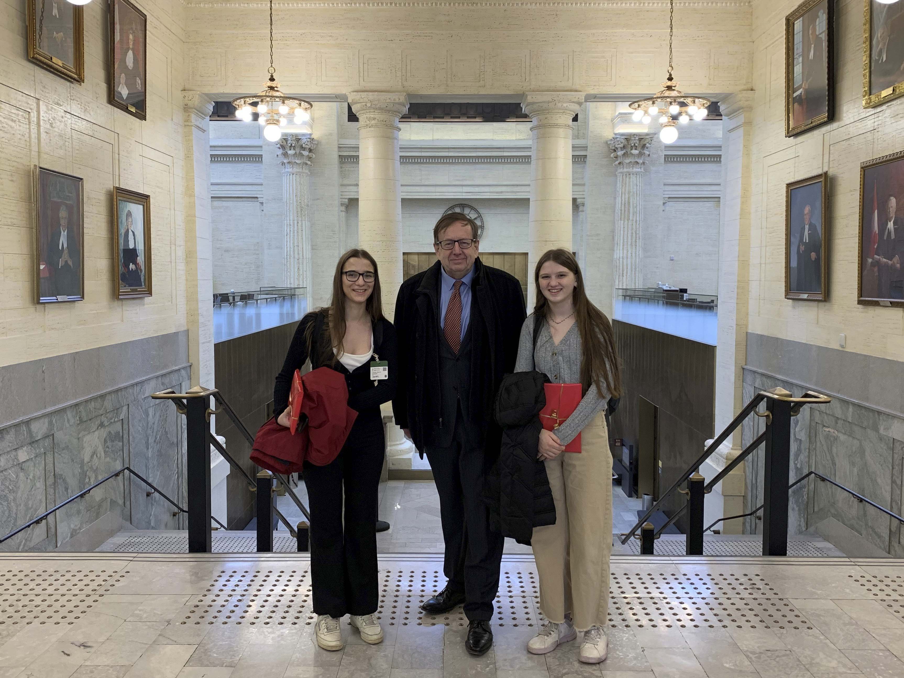 Monday, November 21, 2022 – Senator Percy E. Downe, centre, gives a tour of the Senate of Canada Building to Chanel Kershaw, left, and Vivian Naumenko, right, the winners of Create Your Canada contest. The initiative, by Vancouver Kingsway MP Don Davies, invites students to propose legislation that would make Canada or the world a better place.