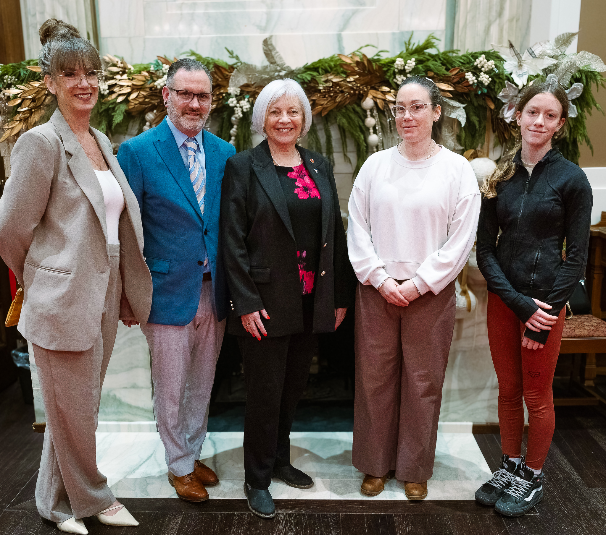 Senator Hartling stands with her family during her retirement reception on December 10, 2024. From left, daughter-in-law Jody, son Marc, daughter Melissa and granddaughter Anouk Julian. (Photo credit: Office of Senator Nancy J. Hartling)