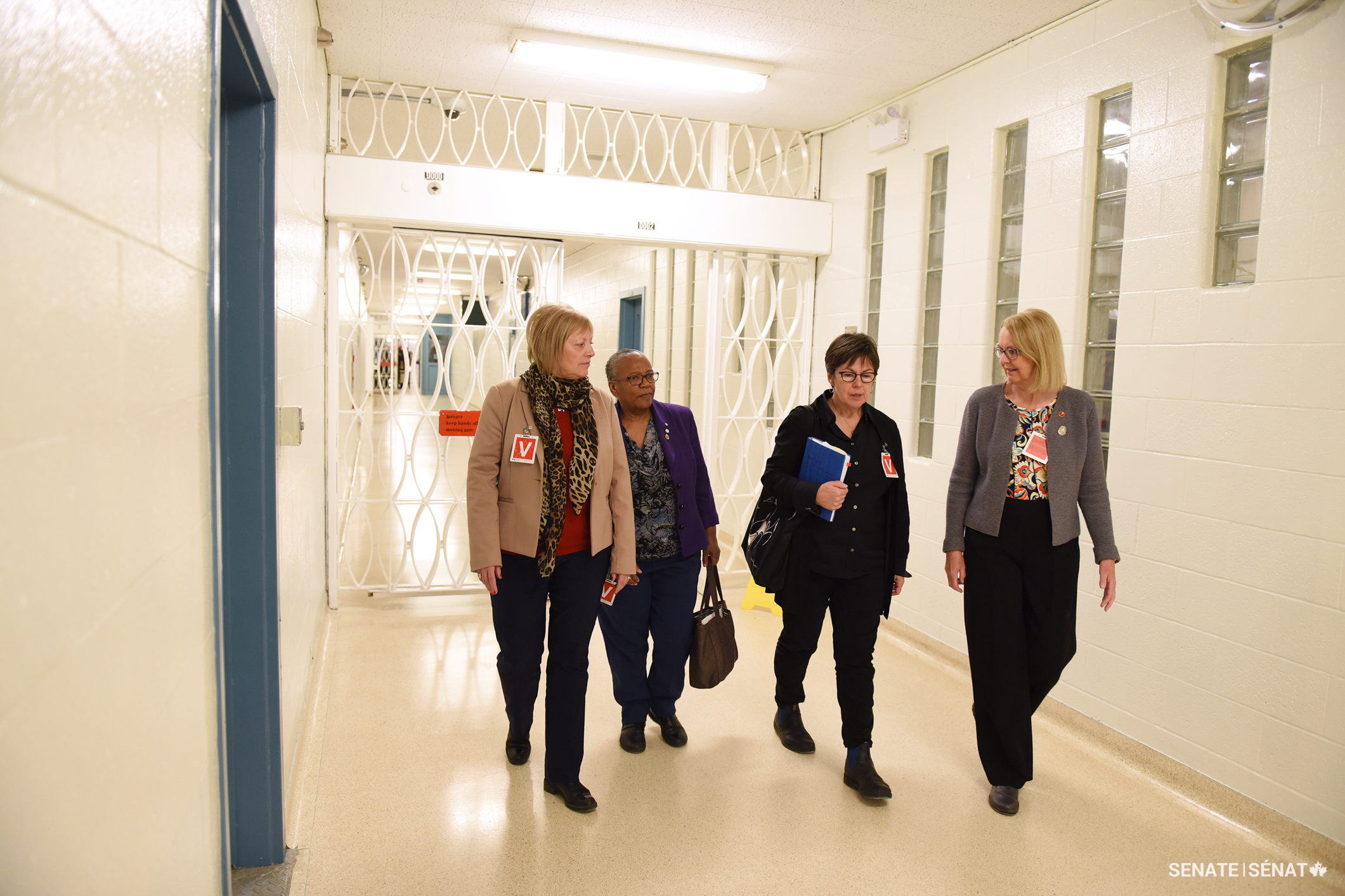 From left, senators Hartling, Wanda Thomas Bernard, Kim Pate and Jane Cordy walk through a men’s maximum-security facility in New Brunswick during a Senate Committee on Human Rights fact-finding mission on the human rights of prisoners in 2018.