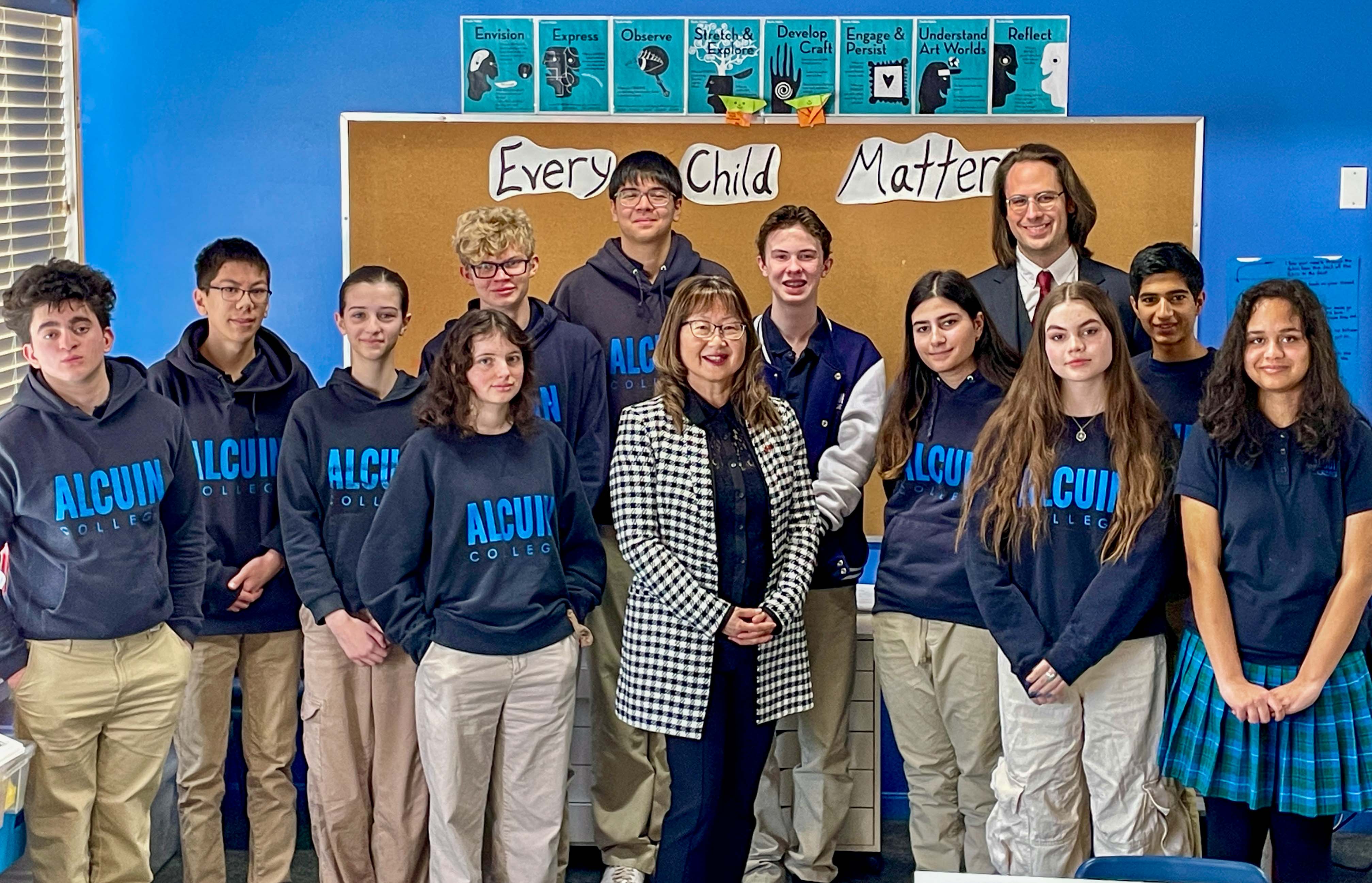 Tuesday, January 28, 2025 – Senator Yonah Martin, centre; visit with students and Mr. Jan de Beer; Alcuin College, Vancouver, British Columbia.