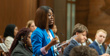 Model senator Kazia Grace Macbruce stands at her desk in the Senate Chamber.