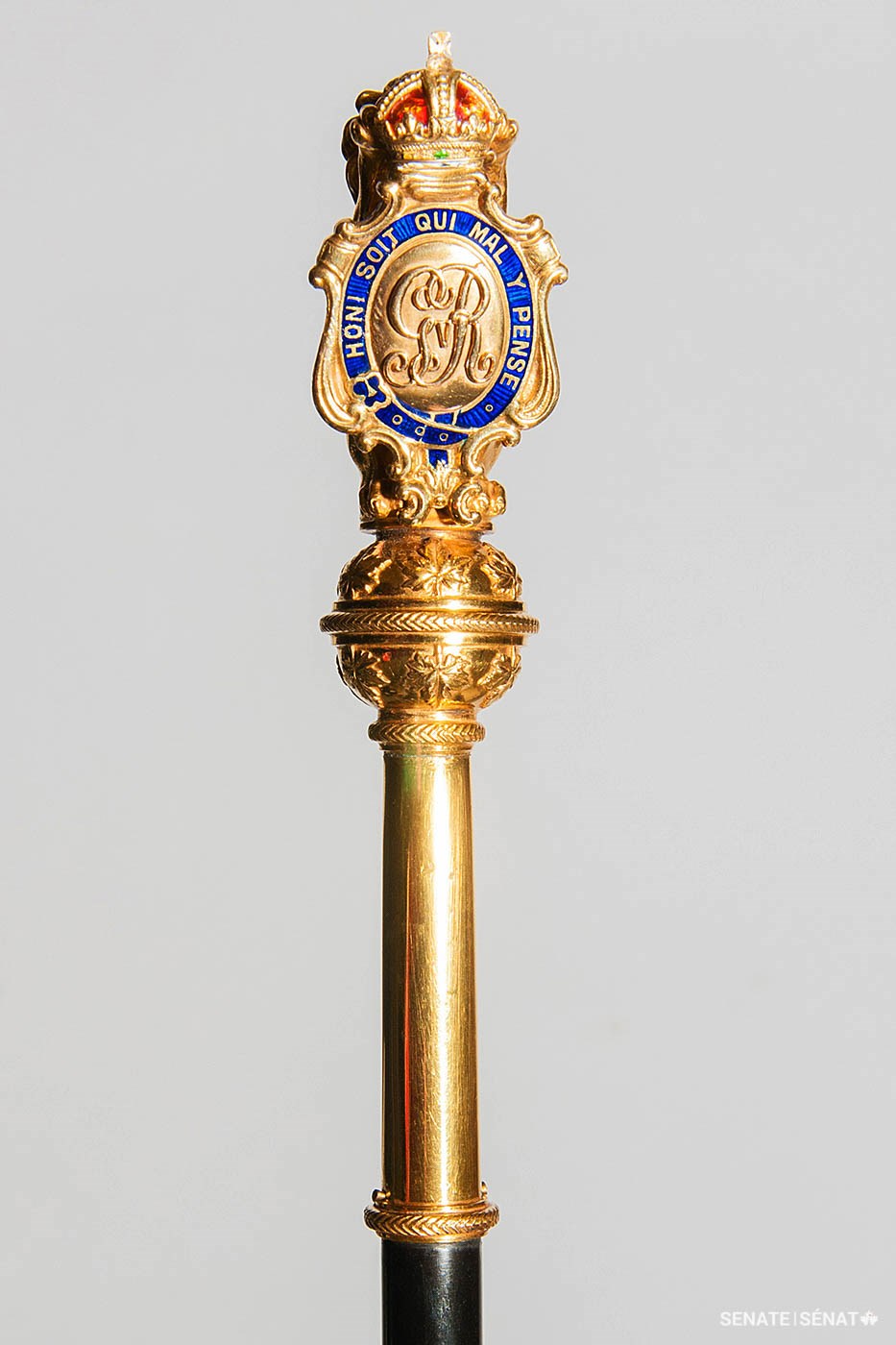 The Usher of the Black Rod’s ebony staff of office is capped by a shield displaying the royal cypher of King George V, Canada’s monarch when the staff was crafted in 1918.