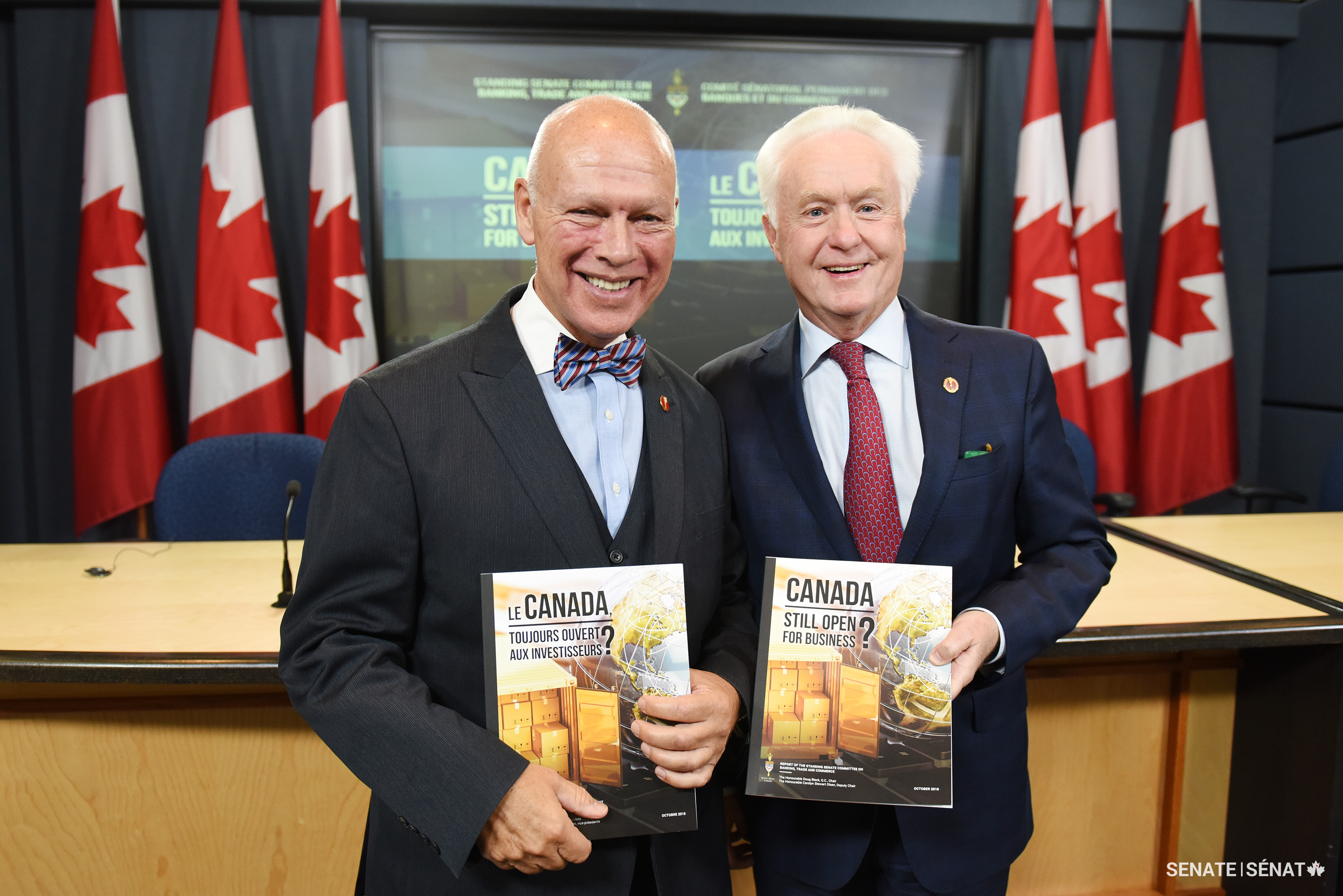 Senators Dagenais and Doug Black present the Senate Committee on Banking, Commerce and the Economy report Canada: Still Open for Business? in 2018.