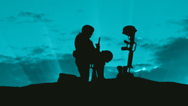 A silhouette of a soldier kneeling before a gun, boots and helmet against a blue sky.
