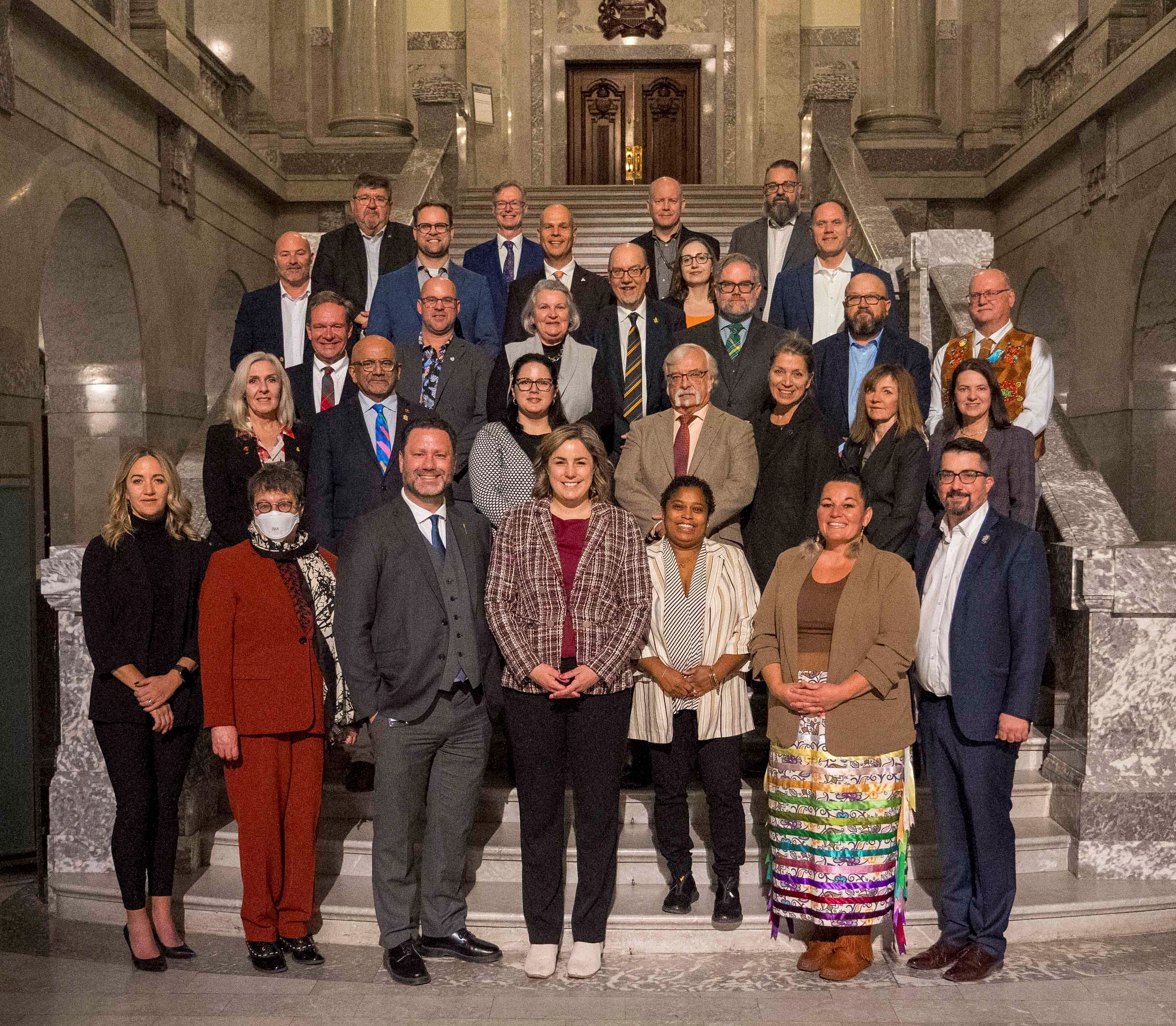 Friday, October 18, 2024 – Senator Paula Simons, front row, second from left, Rebecca Patterson second row, left, Andrew Cardozo second row, second from left, and participants at the Commonwealth Parliamentary Association Regional Conference; Alberta Legislature Building, Edmonton, Alberta. Photo credit: Ian Jackson.